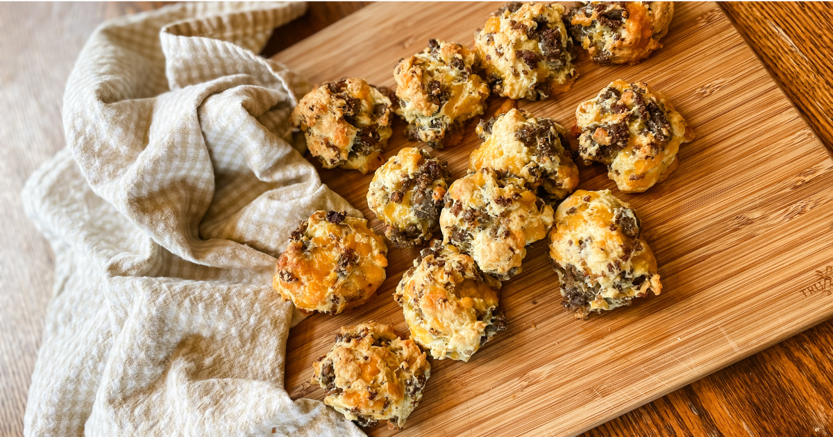 sausage biscuits on a cutting board