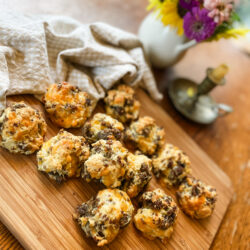 sausage balls on a wooden cutting board