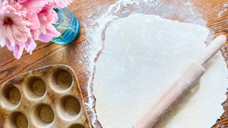rolling pin and dough on a table