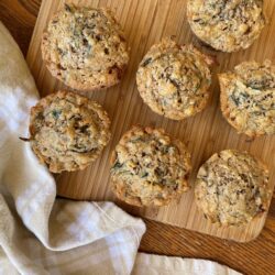 muffins on a cutting board with a towel