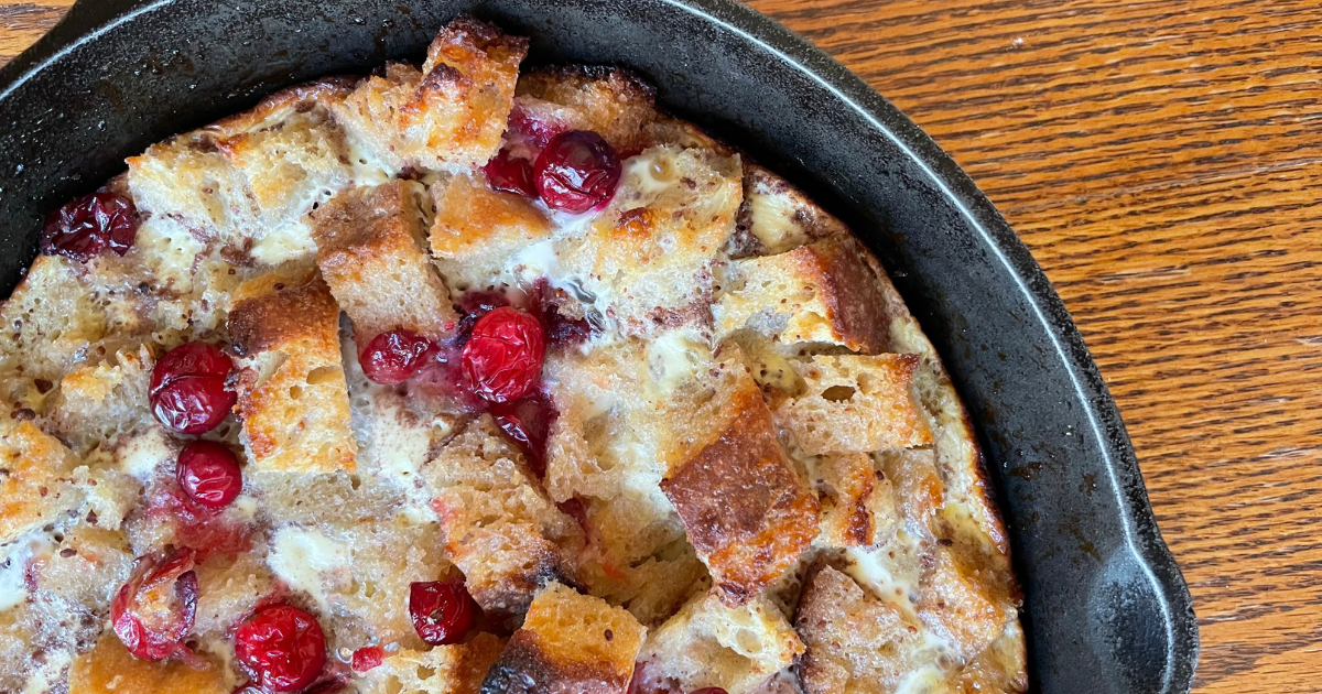french toast and cranberries in a skillet